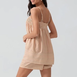 Detailed back view showing the elastic smocking on the striped sleeveless top and shorts