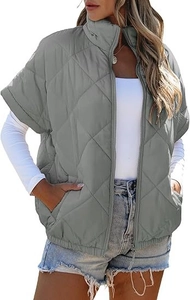 Detail of grey quilted vest featuring a stand collar and classic diamond stitch pattern