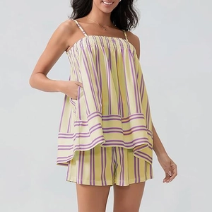 Detail of smocked sleeveless striped top and shorts set in yellow and purple