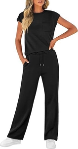 Detailed close-up of a black casual two-piece set featuring a crew neck top with a chest pocket