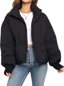 Detail of black puffer jacket with standing collar and ribbed windproof sleeve cuffs
