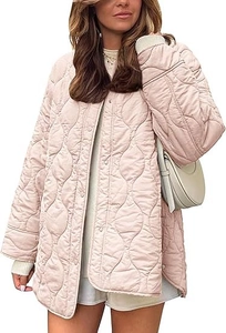 Detail of light pink quilted jacket featuring wave stitching and neat button closure