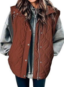Close-up of brown quilted vest featuring metal zipper and snap button closure