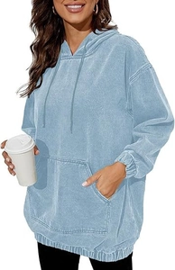 Detail of light blue acid wash hoodie featuring a drawstring hood and kangaroo pocket