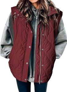 Detail of burgundy quilted vest with zipper and silver snap buttons over a grey hoodie