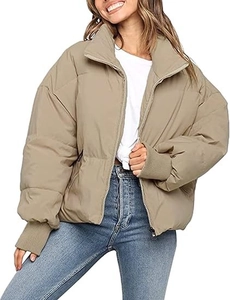 Short puffer jacket detail featuring ribbed cuffs and a stand collar in khaki color