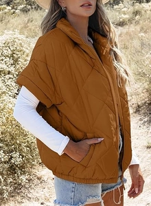 Detail of caramel quilted vest with diamond pattern, zip closure and side pockets
