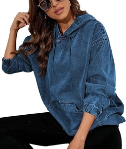Detailed texture of dark blue washed denim-style oversized hoodie with adjustable drawstring