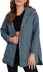 Detail view of blue quilted diamond pattern hooded jacket with snap buttons and side slits