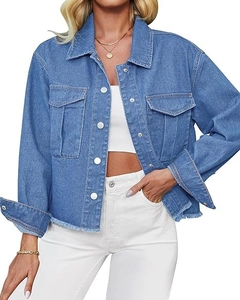 Detailed view of women's denim jacket with flap pockets and frayed fringe hem finish