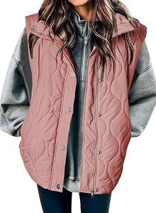 Detail of pink wave-quilted vest showing zipper, button closure and premium fabric texture