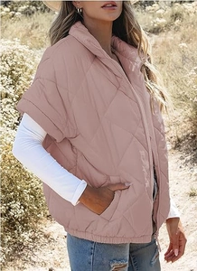 Close-up of pink quilted puffer vest with zipper closure and diamond stitch texture