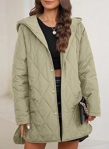 Detail of sage green diamond quilted jacket featuring metal snap buttons and curved hem