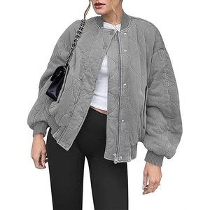 Oversize grey quilted bomber jacket with wavy stitching and ribbed cuffs on white background