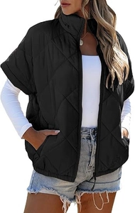 Detail shot of women's black quilted puffer vest with diamond patterns and stand collar