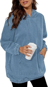 Detailed close-up of light blue washed denim hoodie with kangaroo pocket and drawstrings