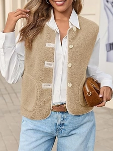 Detail of khaki faux shearling vest featuring round neck, front buttons, and soft fleece texture