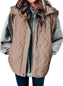 Close-up of wave-quilted vest featuring stand collar, metal snaps, and zipper closure