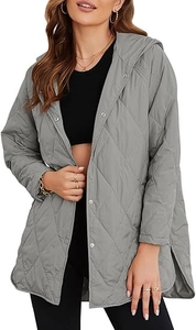 Detail of light gray quilted jacket with silver snap buttons and high side slit design