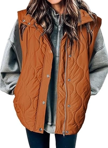 Detail of orange quilted vest showing zipper, metal buttons, and wavy stitch texture
