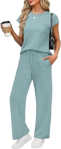 Detail of solid color round neck top with chest pocket and elastic drawstring waistband