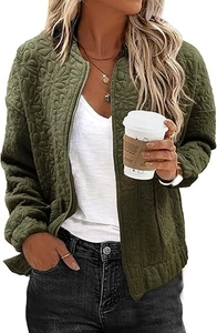 Detail of army green quilted jacket featuring embossed floral texture and zipper closure