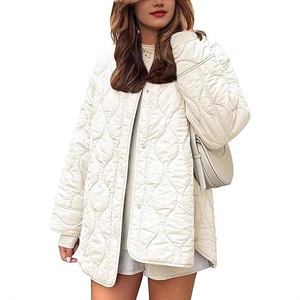 Women's white quilted jacket with a round neck and metal buttons in a relaxed fit