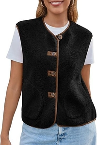 Detail of black faux shearling vest featuring wood-style buttons and brown contrast trim