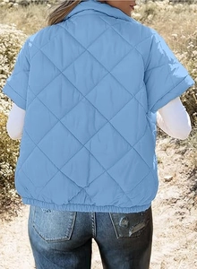 Back view of light blue quilted short sleeve vest jacket with diamond pattern texture