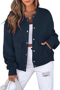 Detailed view of navy blue short jacket featuring metal buttons and ribbed cuffs