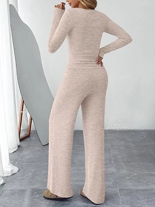 Detail view of beige two-piece loungewear set with wide-leg pants and slim top