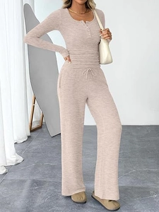 Detail showing ribbed knit fabric texture of the long sleeve top and wide leg pants set