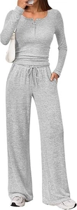 Detail of grey knitted two-piece set featuring long-sleeve Henley top and drawstring pants