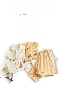 Detailed embroidery of small bear and Pedrinho text on cotton sateen pajama pocket
