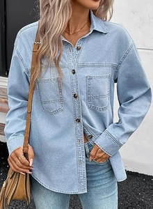 Close-up of a light blue washed denim shirt with brown buttons and double chest pockets