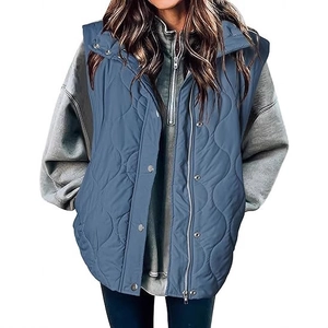 Women's dark blue quilted vest with wave pattern, metal zipper and snap buttons closure