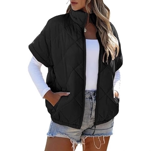 Women's black quilted puffer vest with stand collar and diamond pattern zipper closure