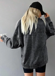Rear view of oversize dark grey acid wash denim jacket with stylish drop shoulder design