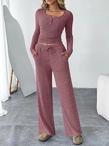 Detail of soft heathered pink lounge set with long sleeves and wide leg drawstring pants