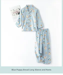 Detail of light blue cotton pajamas with cartoon dog and bread patterns on white background