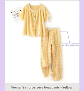 Détail du haut de pyjama en crêpe de coton jaune avec dentelle et broderie florale fine