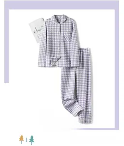 Detail of purple and white checkered cotton pajama set for women with long sleeves and buttons