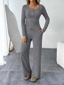 Close-up of heather grey knitted loungewear set featuring drawstring waist and button detail