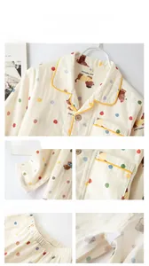 Detail view of cotton kids pajamas featuring dog prints and collar stitching