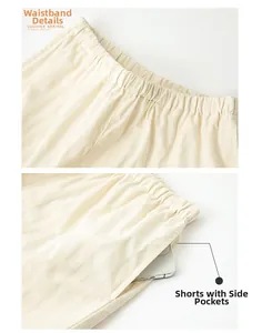 Detail of elastic waistband and side pockets on striped cotton sateen pajama shorts