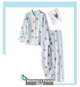 Detail of light blue women's quilted pajama set with red peach print and buttoned shirt