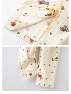 Close-up of cotton pajama set featuring cartoon dachshund print and wooden buttons
