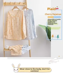 Detail of cotton gauze pajama set showing cherry pattern and breathable texture