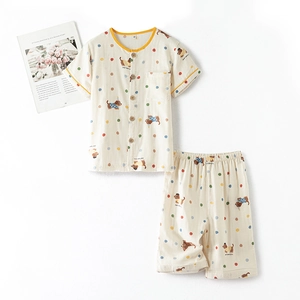Kids cotton pajamas set with cartoon dog prints and colorful dots on cream base