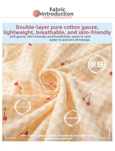 Detail of yellow cherry cotton gauze fabric showing soft texture and breathable weave